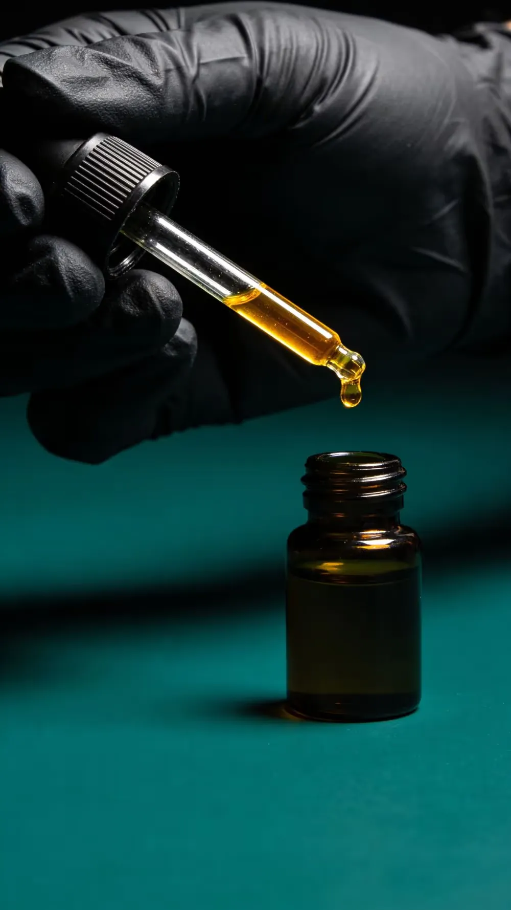 Pure fragrance oil being poured into a bottle